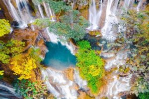 Pak Ou Caves and Kuang Si Fall Day Tour - Pak Ou Caves: Limestone Cliffs, Two Caves, and Buddha Images Everywhere