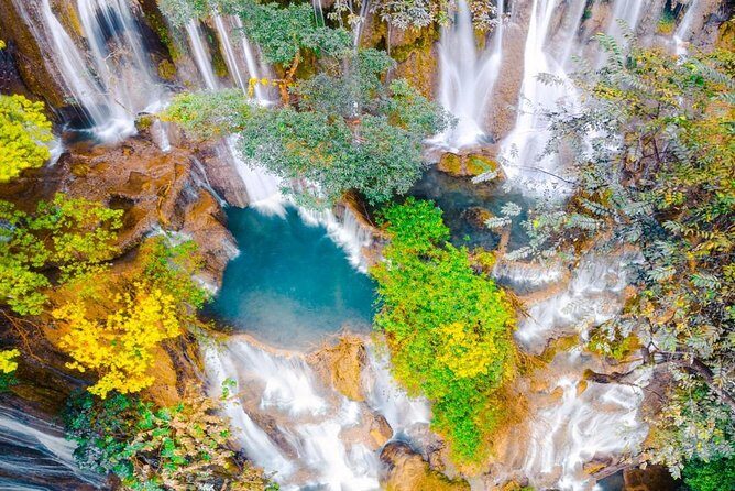 Pak Ou Caves and Kuang Si Fall Day Tour - Pak Ou Caves: Limestone Cliffs, Two Caves, and Buddha Images Everywhere